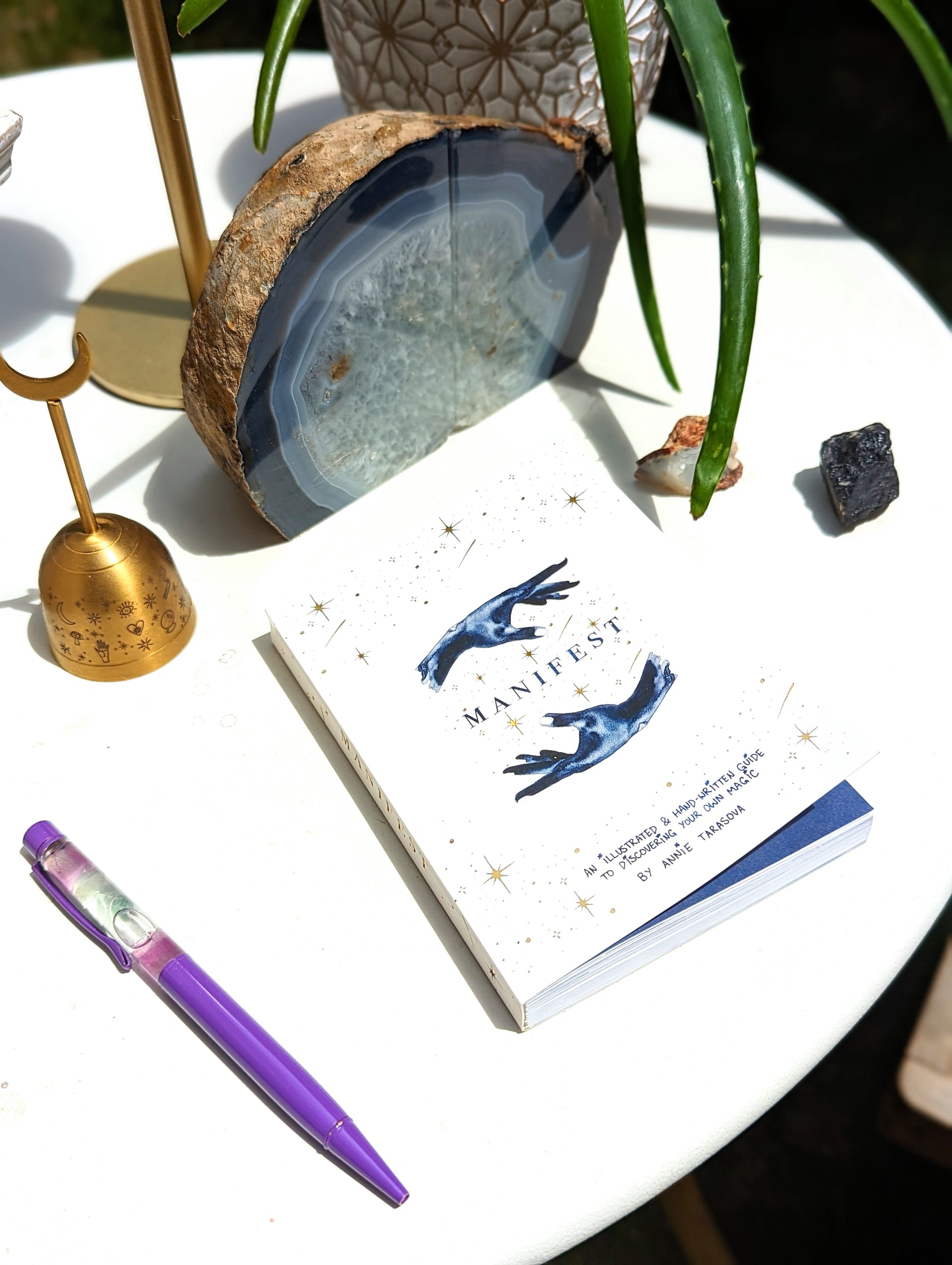 Dreamy moons manifest workbook featuring journal prompts and vision boards. Available at Goddess Provisions