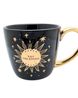 Black and celestial ceramic mug with moon and sun design available at Goddess Provisions